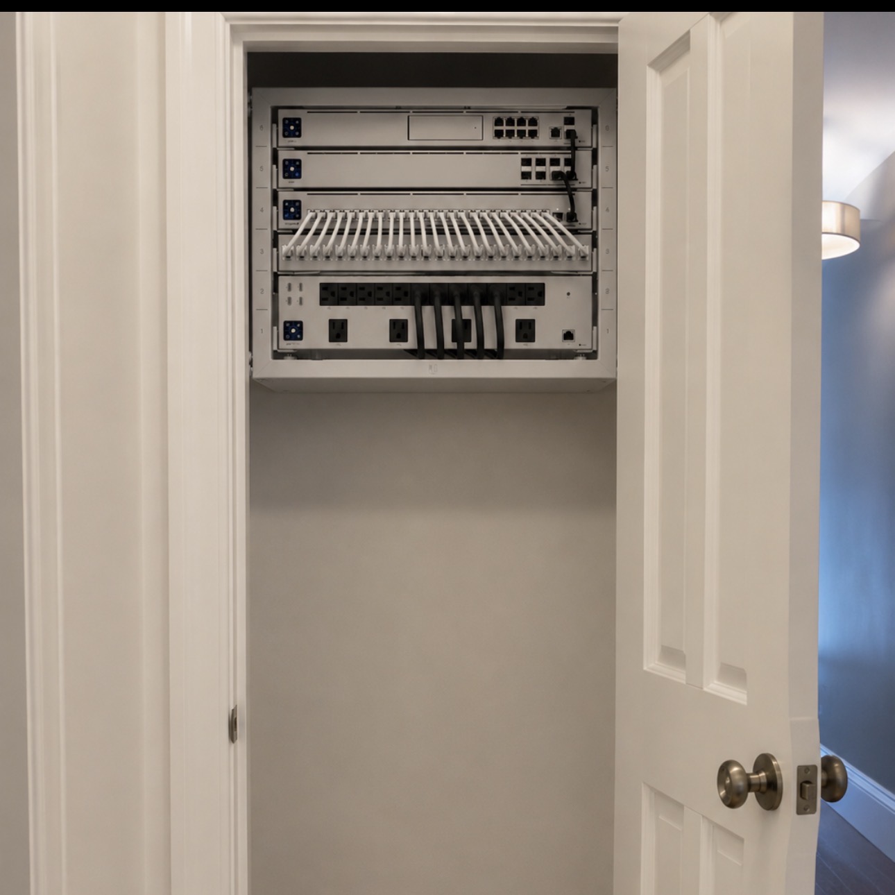 Professional wall-mounted home network rack installation in Orlando