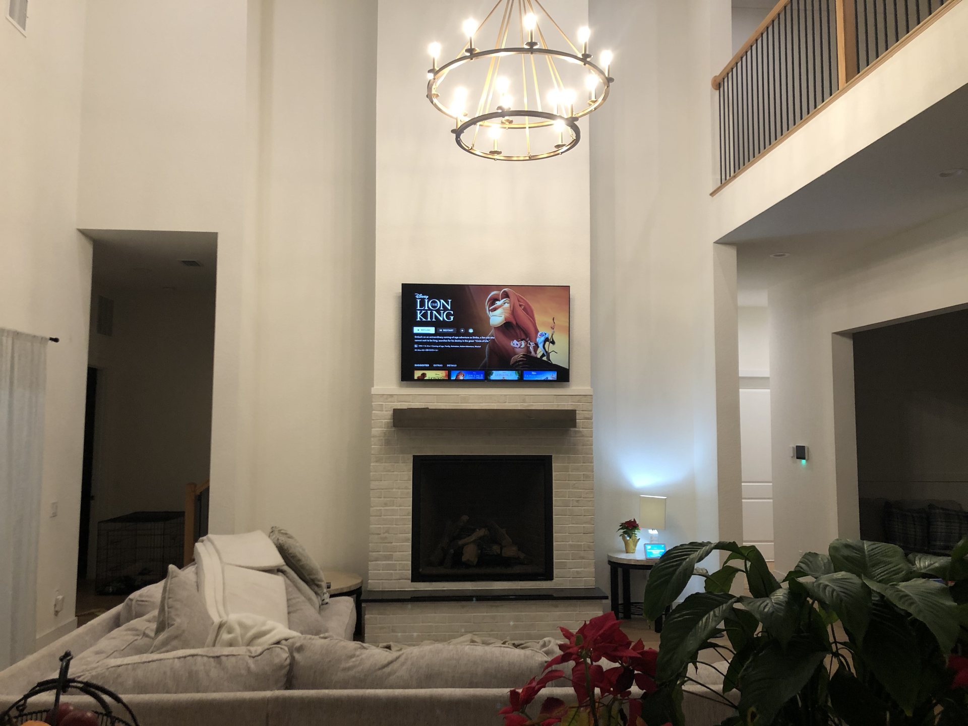 Television mounted above a fireplace in a Clermont home with all wiring concealed in the wall
