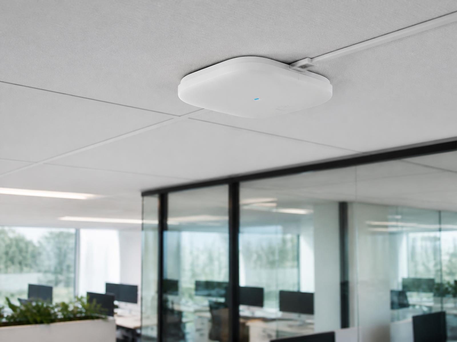 Business-grade ceiling-mounted wireless access point installed in an Orlando commercial office as part of a professionally designed Wi-Fi network